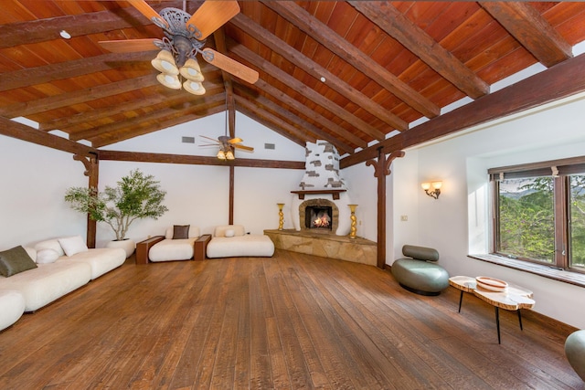 unfurnished living room featuring wood-type flooring, wood ceiling, lofted ceiling with beams, a fireplace, and ceiling fan