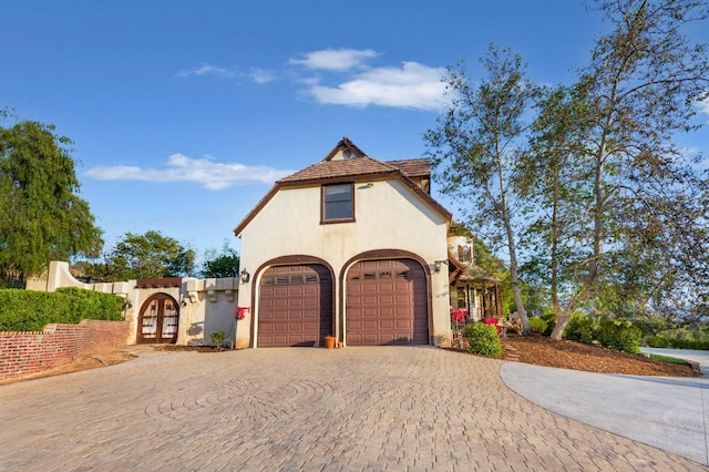 exterior space with decorative driveway