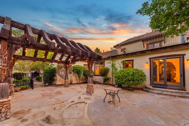 view of patio / terrace with fence, entry steps, and a pergola