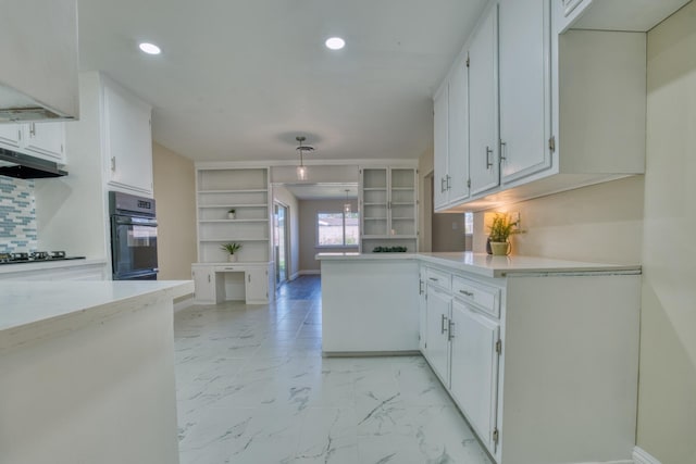 45209 Lorimer Ave, Lancaster, CA 93534 - kitchen featuring oven, open shelves, light marble finish floors, recessed lighting, and light countertops