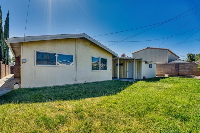 45209 Lorimer Ave, Lancaster, CA 93534 - rear view of house with stucco siding