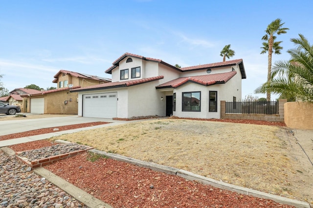 mediterranean / spanish-style home featuring a garage