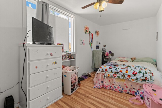 bedroom with wood-type flooring and ceiling fan