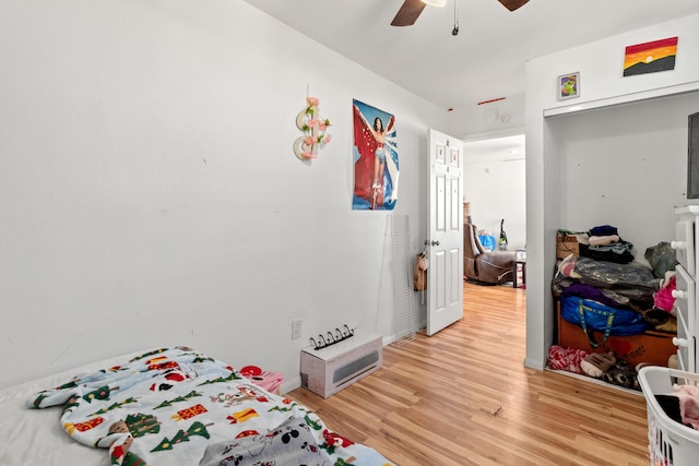 bedroom featuring ceiling fan and light hardwood / wood-style flooring