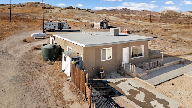 exterior space with central air condition unit and a mountain view