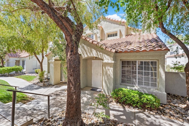 37940 E 42nd St Apt 115, Palmdale, CA 93552 - mediterranean / spanish-style house featuring a tile roof and stucco siding