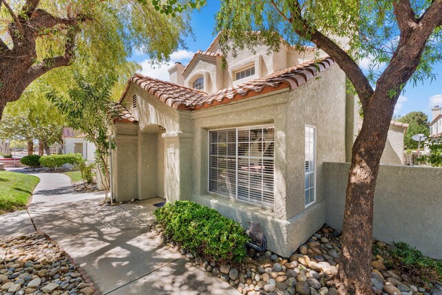 37940 E 42nd St Apt 115, Palmdale, CA 93552 - view of front of home with stucco siding and a tile roof