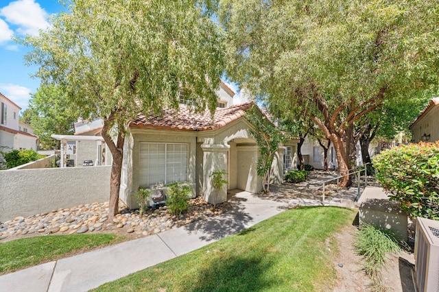 37940 E 42nd St Apt 115, Palmdale, CA 93552 - mediterranean / spanish house with a tile roof, stucco siding, and a cooling unit