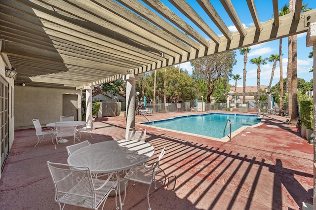37940 E 42nd St Apt 115, Palmdale, CA 93552 - community pool with a pergola, a patio, and outdoor dining space