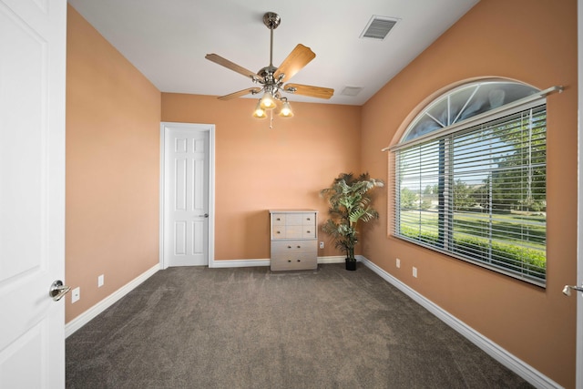 carpeted empty room with ceiling fan