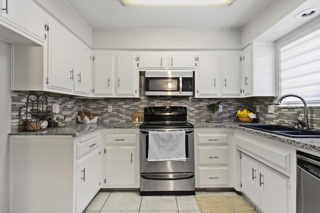 kitchen featuring sink, white cabinetry, and stainless steel appliances