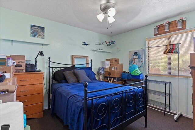 21104 Hillcrest Ct, Tehachapi, CA 93561 - carpeted bedroom featuring a textured ceiling and ceiling fan
