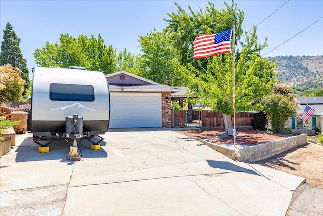 21104 Hillcrest Ct, Tehachapi, CA 93561 - view of front facade featuring a garage and concrete driveway