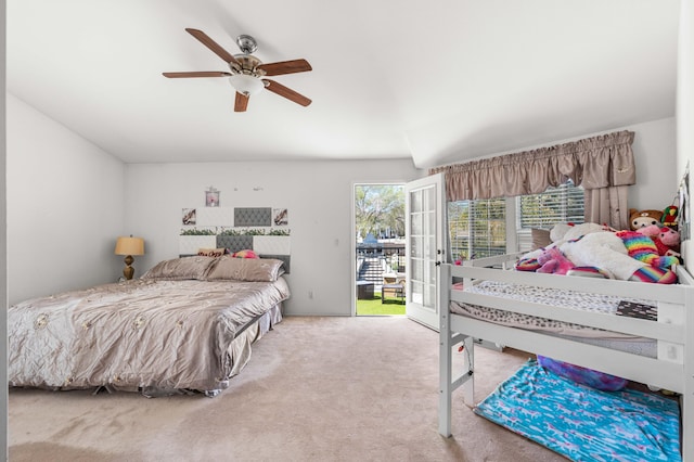 bedroom featuring carpet floors, access to exterior, and a ceiling fan