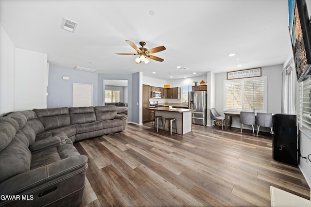 2038 Howard St, Rosamond, CA 93560 - living room featuring ceiling fan, dark wood-style flooring, healthy amount of natural light, and recessed lighting