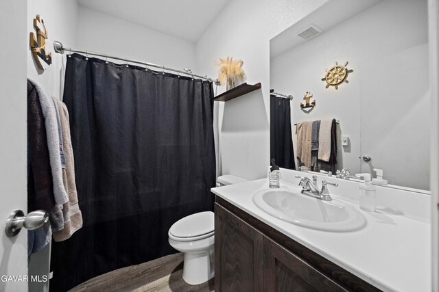 2038 Howard St, Rosamond, CA 93560 - full bathroom featuring vanity and wood finished floors