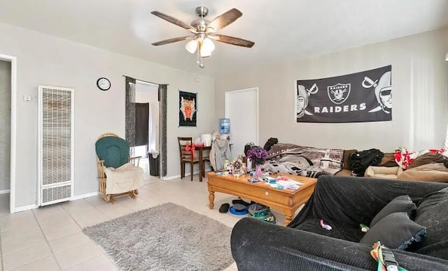 209 Pictorial St, Palmdale, CA 93550 - living area featuring a heating unit, a ceiling fan, tile patterned flooring, and baseboards