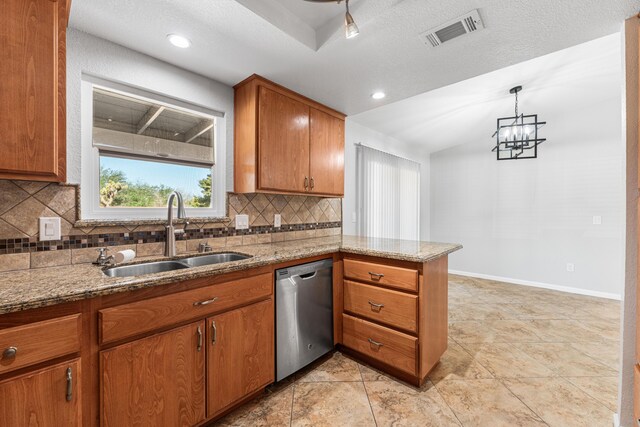 kitchen featuring stainless steel dishwasher, visible vents, a peninsula, tasteful backsplash, and a sink