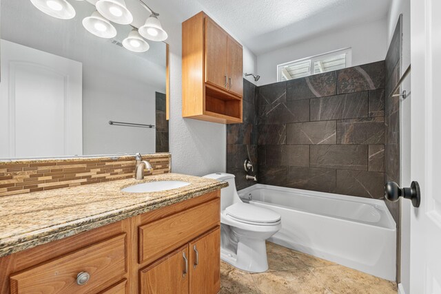 full bath featuring vanity, tasteful backsplash, toilet, and bathing tub / shower combination