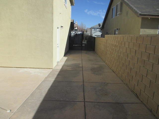 view of property exterior featuring fence and stucco siding