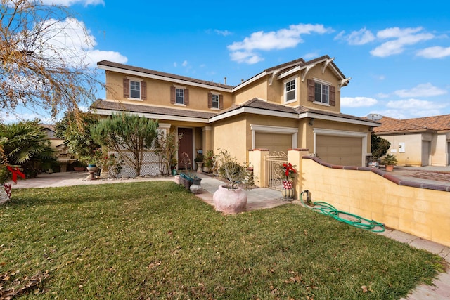 view of front of property featuring a garage and a front lawn