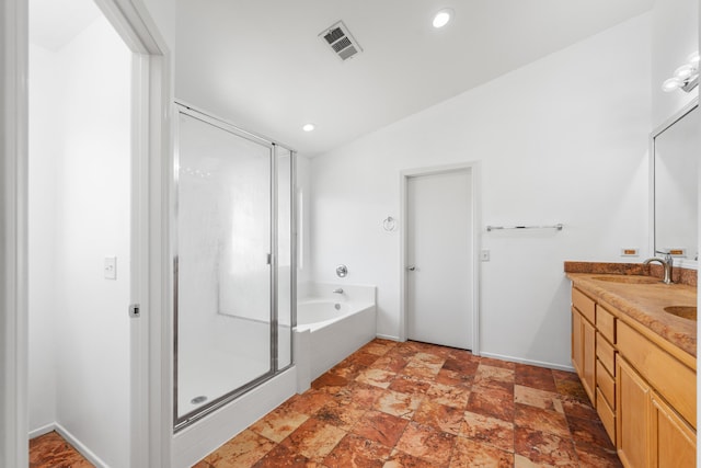 bathroom with vanity, plus walk in shower, and vaulted ceiling