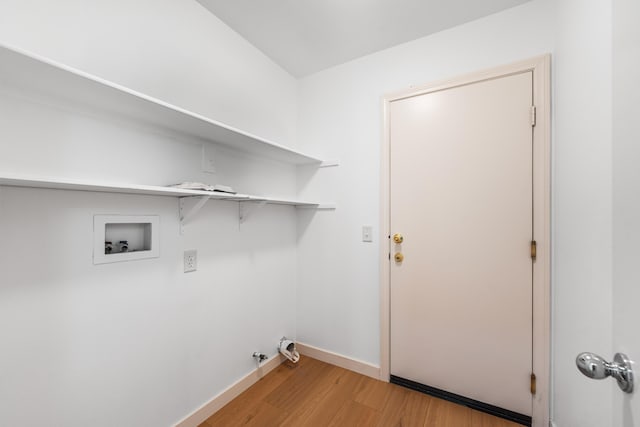 laundry room with hookup for a gas dryer, washer hookup, and light wood-type flooring