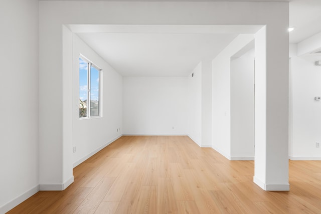 spare room with light wood-type flooring