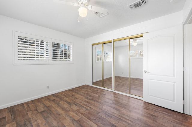 40836 W 36th St, Palmdale, CA 93551 - unfurnished bedroom with multiple closets, wood finished floors, and a ceiling fan