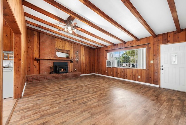 40836 W 36th St, Palmdale, CA 93551 - unfurnished living room with washer / clothes dryer, light wood-style floors, ceiling fan, and wooden walls