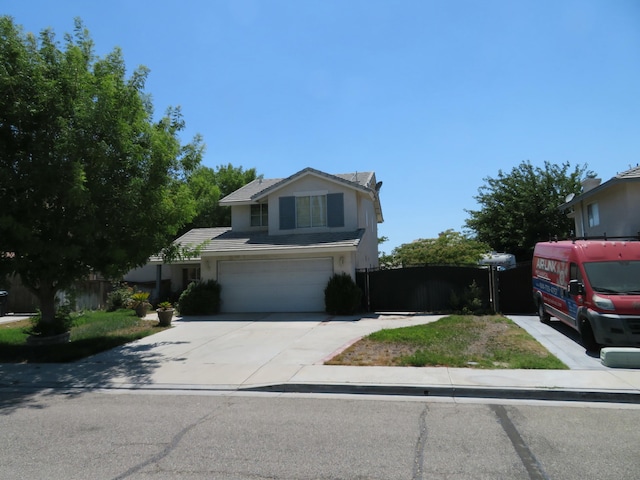 traditional-style house featuring stucco siding, an attached garage, driveway, and fence