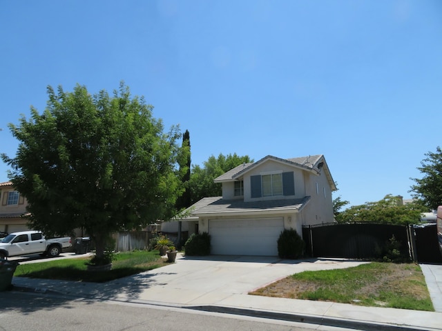 traditional-style home featuring fence, driveway, stucco siding, a garage, and a tiled roof