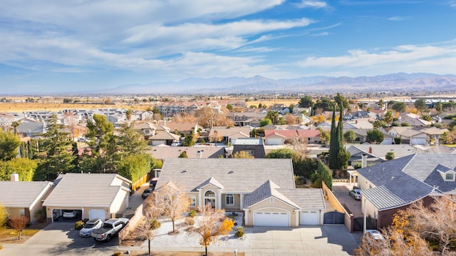 drone / aerial view with a residential view and a mountain view