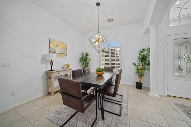 dining room with decorative columns, baseboards, visible vents, and light tile patterned flooring