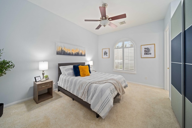 bedroom featuring a ceiling fan, carpet flooring, baseboards, and visible vents