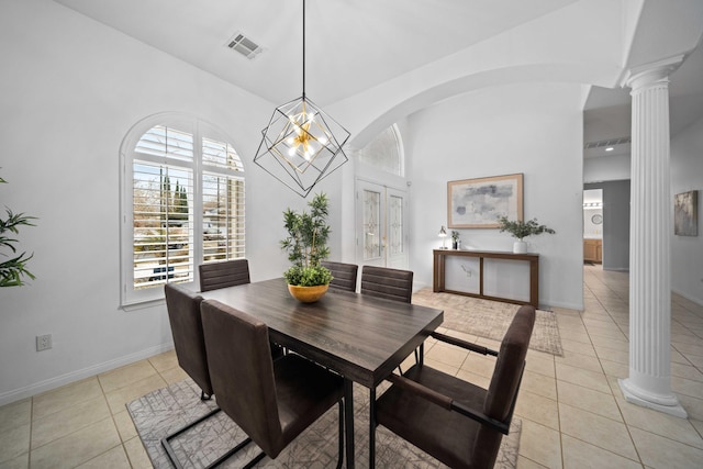 dining area featuring light tile patterned floors, visible vents, baseboards, and ornate columns