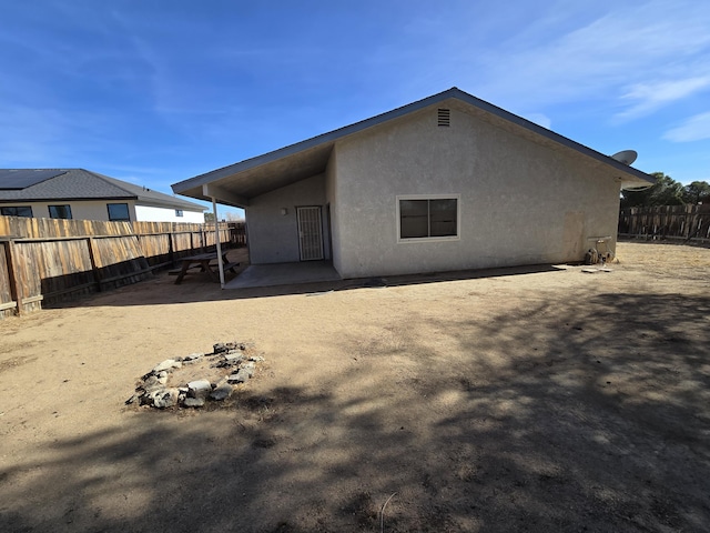 rear view of house with a patio