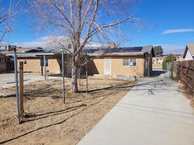 view of home's exterior featuring solar panels