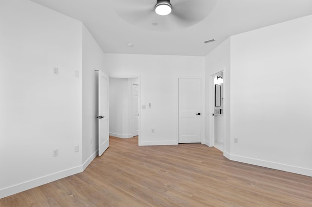 unfurnished bedroom with visible vents, ceiling fan, baseboards, and light wood-style floors