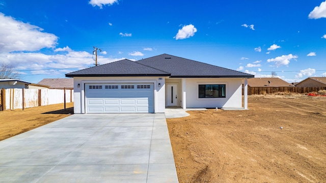 single story home featuring fence, concrete driveway, roof with shingles, stucco siding, and an attached garage