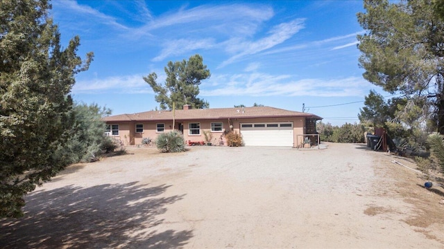 single story home with a garage