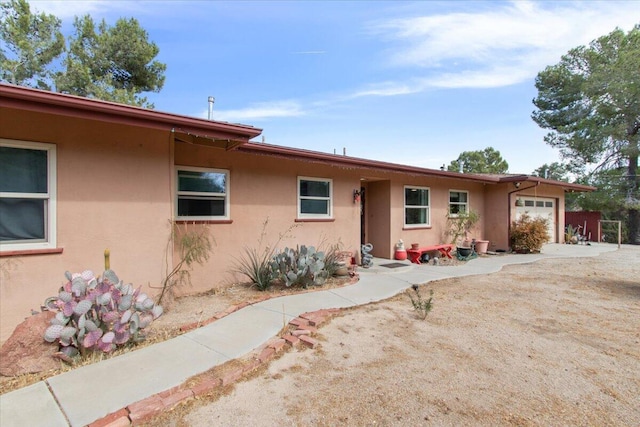 single story home with a garage