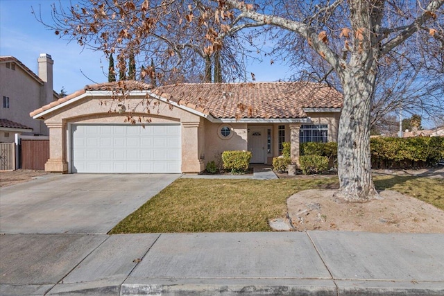 view of front of home featuring a garage and a front lawn