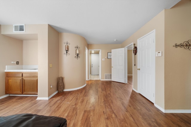 corridor featuring light hardwood / wood-style flooring