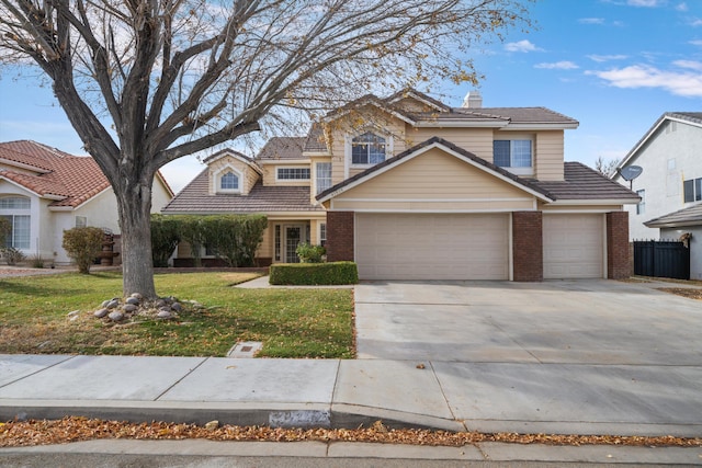 front facade with a front yard and a garage