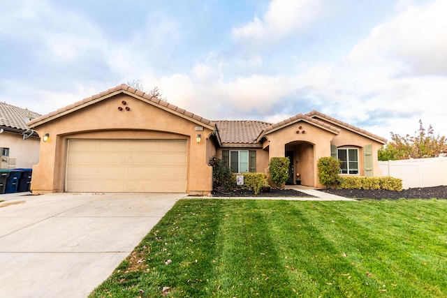 mediterranean / spanish-style house with a front lawn and a garage