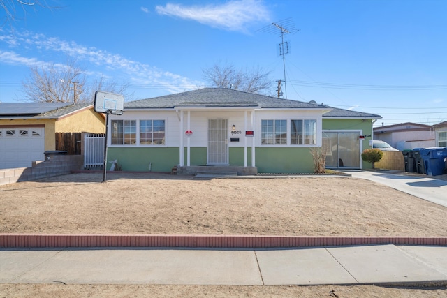 ranch-style home featuring a garage