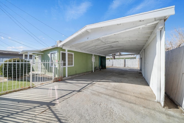 view of parking / parking lot with a carport