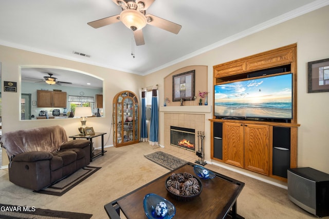 43432 Bale Ct, Lancaster, CA 93535 - carpeted living area with a ceiling fan, ornamental molding, arched walkways, and a tile fireplace