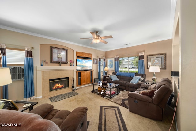 43432 Bale Ct, Lancaster, CA 93535 - living room with a ceiling fan, ornamental molding, a fireplace, and light colored carpet